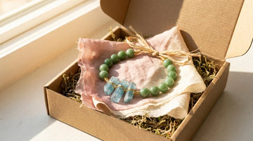 Handcrafted natural Jade and Aquamarine gemstone bracelet presented as a gift for emotional harmony and love.