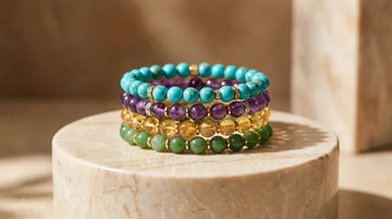 Multi gemstone bracelets stack featuring turquoise amethyst and citrine on marble