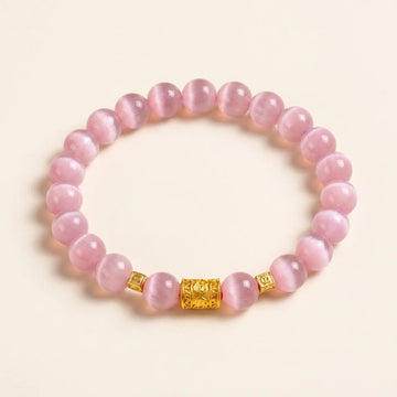 Bracelet en perles d’œil-de-chat rose avec breloque