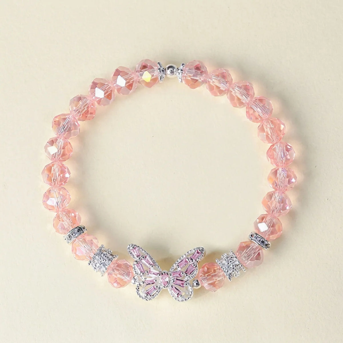 Bracelet en cristal rose avec breloque papillon