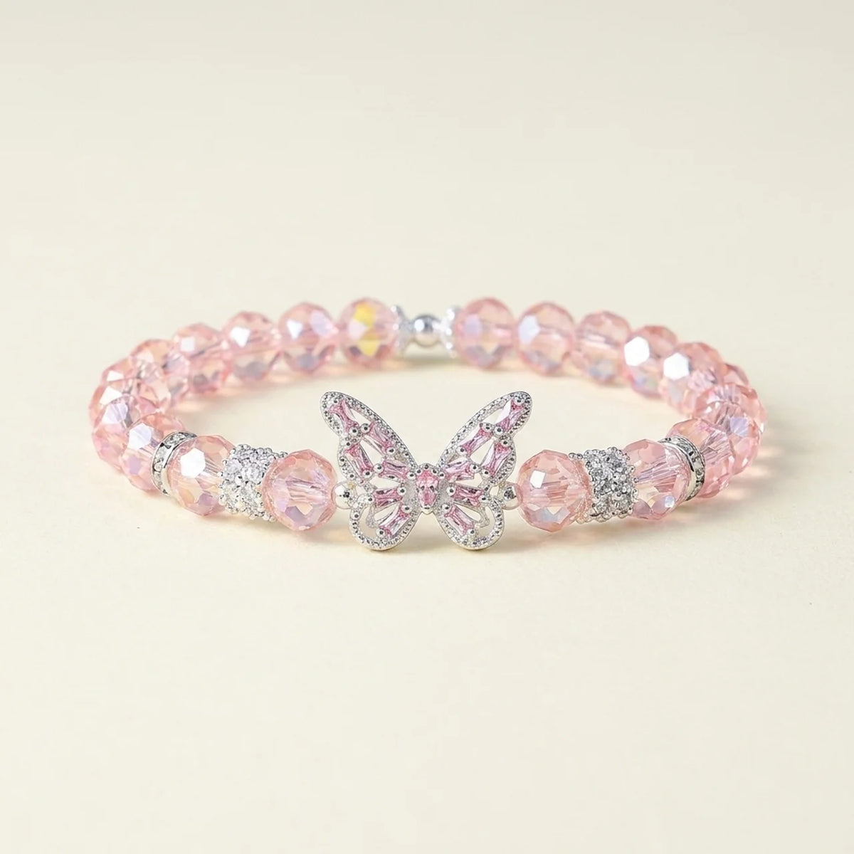 Bracelet en cristal rose avec breloque papillon