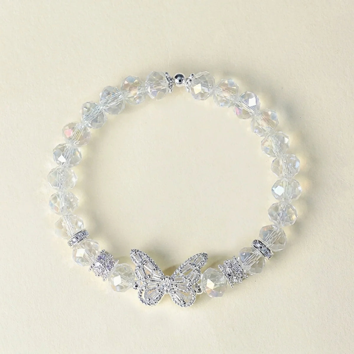 Bracelet en cristal rose avec breloque papillon